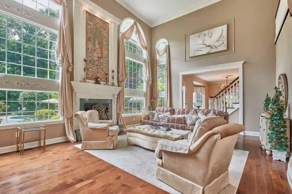 Expansive living room with a cozy fireplace and high ceilings.